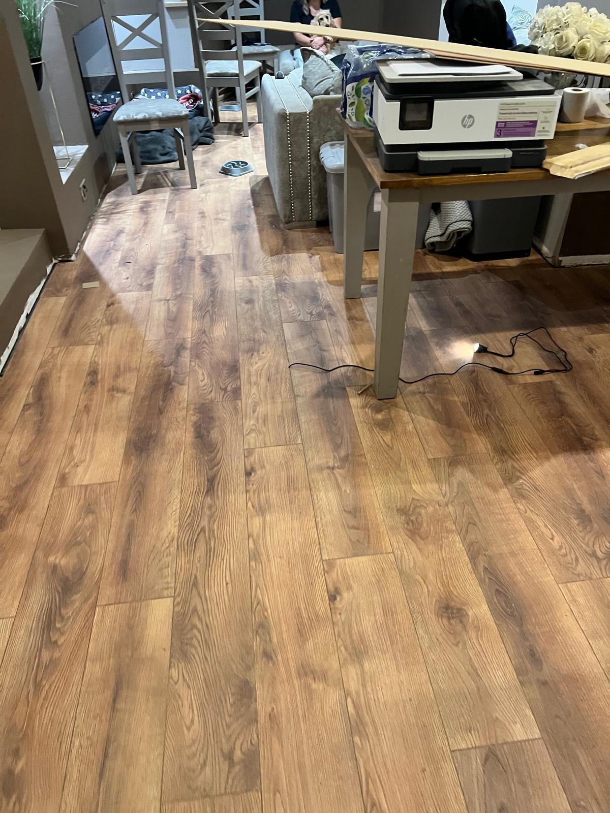 Wood effect LVT flooring installation in occupied interior space