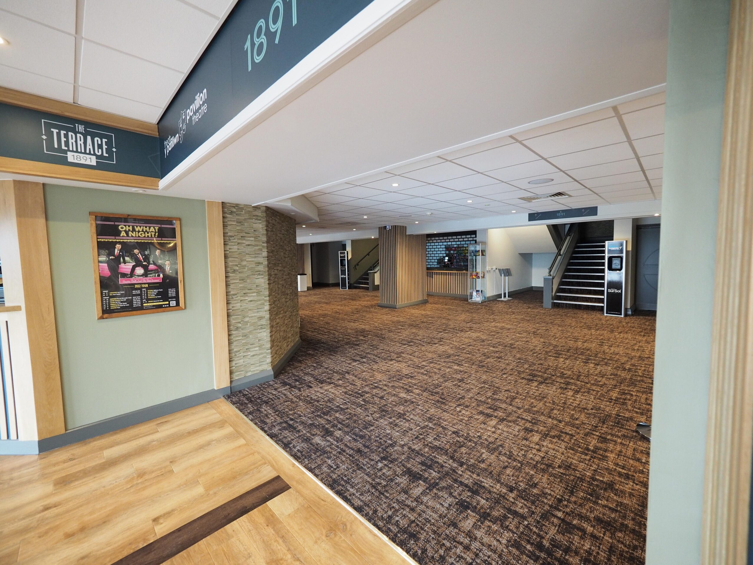 Venue foyer flooring with carpet and timber threshold transition